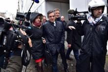 Francois Fillon entre Valérie Pécresse et Jérôme Chartier à la sortie de son QG de campagne le 1er m