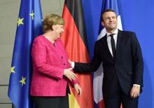 La chancelière allemande Angela Merkel (d) et le président français Emmanuel Macron, lors d'une renc