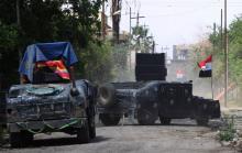 Les forces irakiennes dans une rue de la vieille ville de Mossoul, le 3 mai 2017