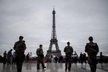 (FILES) This file photo taken on September 29, 2016 shows French Army soldiers patroling in front of