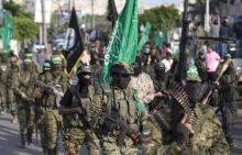 Des membres des brigades Ezzedine al-Qassam, le bras armé du Hamas, défilent à Gaza le 25 juillet 20